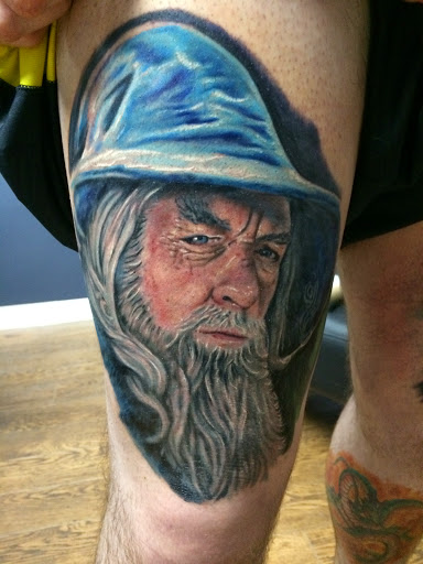 Explore back of the ear tattoo ideas, creative tattoo ideas in Edgewood, available at Evolved Body Arts