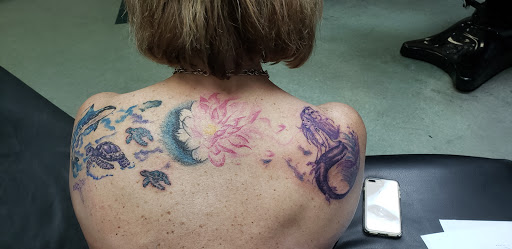 Explore small neck tattoo ideas, creative tattoo ideas in Huntsville, available at Kreations Tattoos & Body Piercing