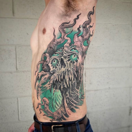 Explore hand skull tattoo ideas, creative tattoo ideas in Tulsa, available at Eleventh & Rockford Tattoo