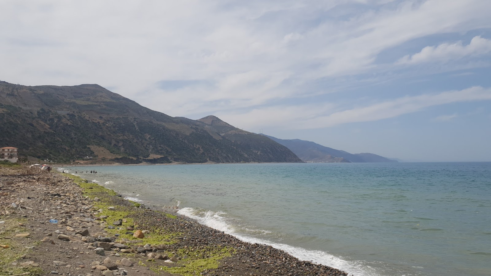 Foto von Plage Taghassa mit türkisfarbenes wasser Oberfläche