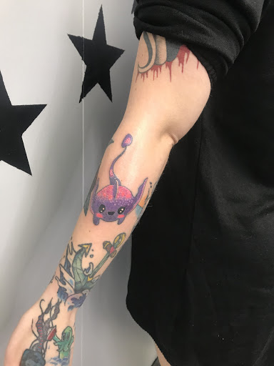 Explore dragonfly tattoo ideas for guys, creative tattoo ideas in Cadillac, available at Limitless Ink Tattoo Studio