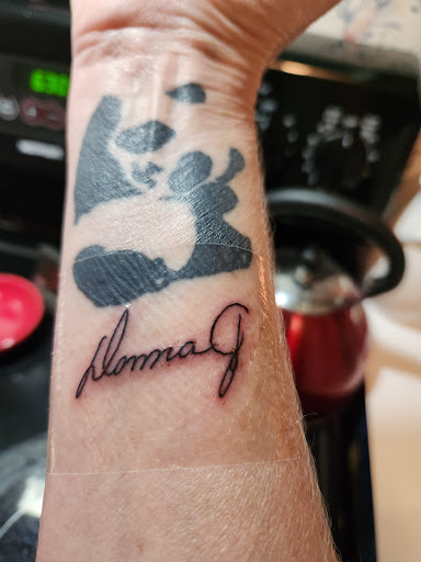 Explore dog bone tattoo ideas, creative tattoo ideas in New Braunfels, available at To The Moon Tattoo Studio