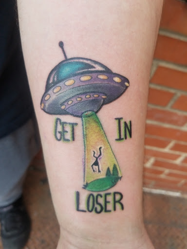 Explore superman tattoo ideas, creative tattoo ideas in Chapel Hill, available at Golden Falcon Tattoo and Piercing