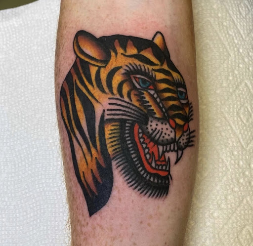Explore wrap around tattoo ideas, creative tattoo ideas in Johnson City, available at Gold Cross Tattoo Co.