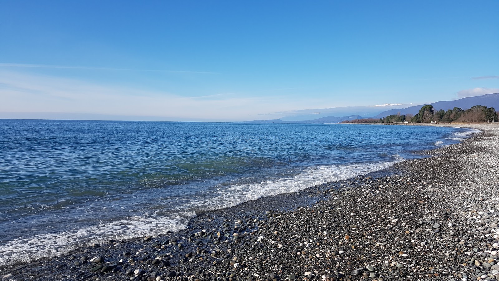 Foto av Kutishna beach med lång rak strand