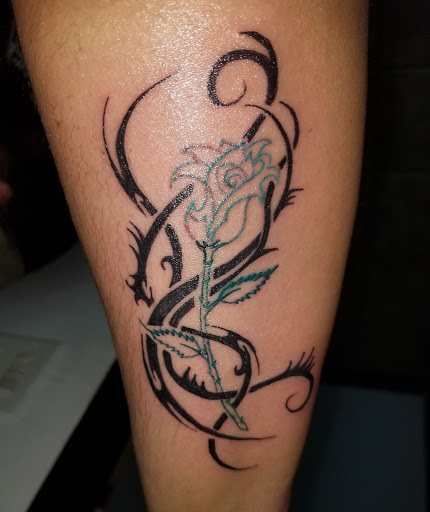 Find owl tattoo ideas for men for your next unique tattoo in Toledo at Artistik Tat2 and Body Piercing