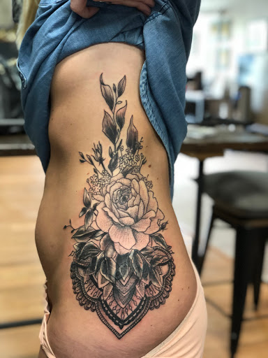 Explore lady thigh tattoo ideas, creative tattoo ideas in Sauk City, available at The Madison Tattoo Company
