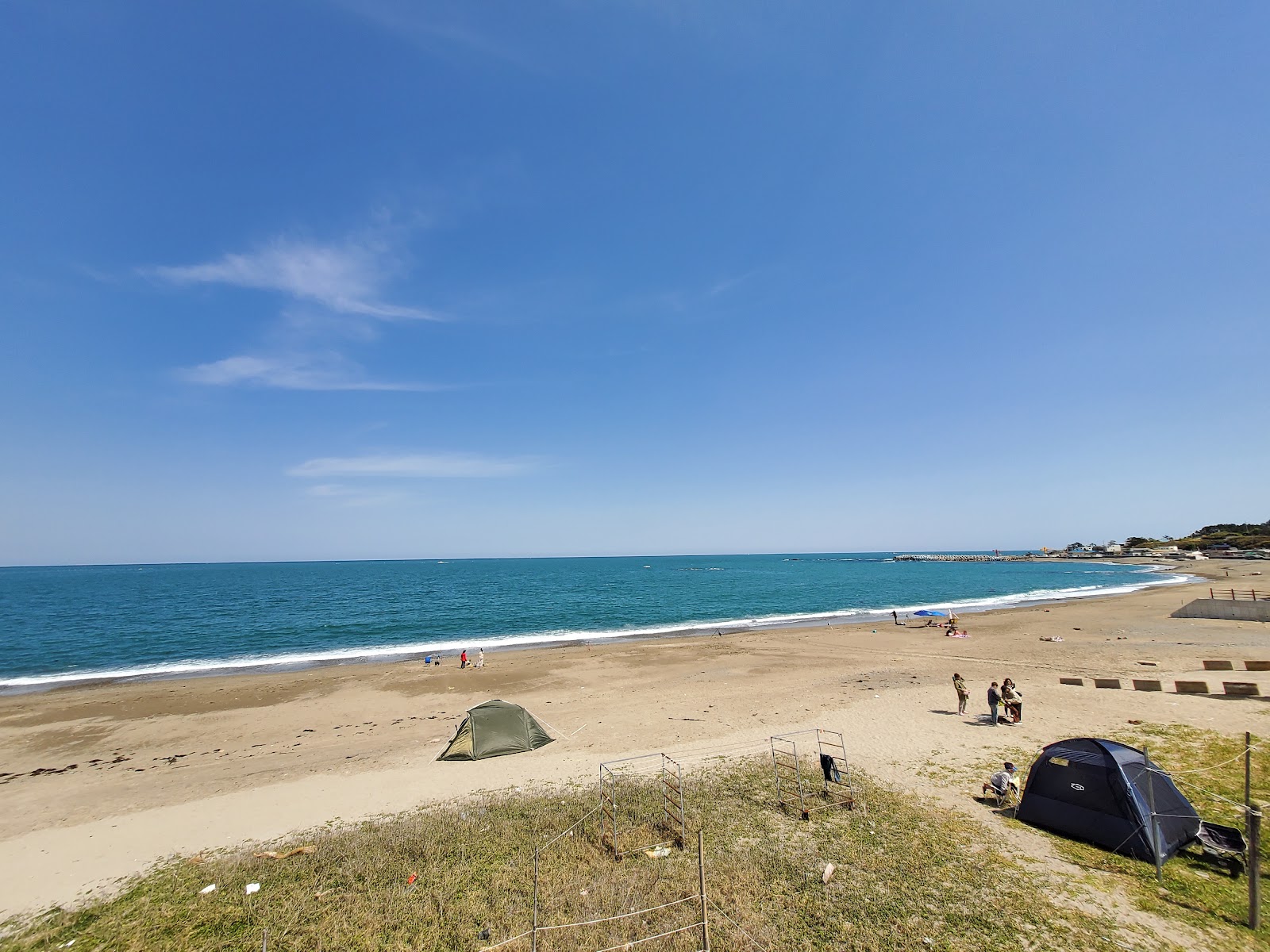 Photo of Shinchanggan Beach with long straight shore