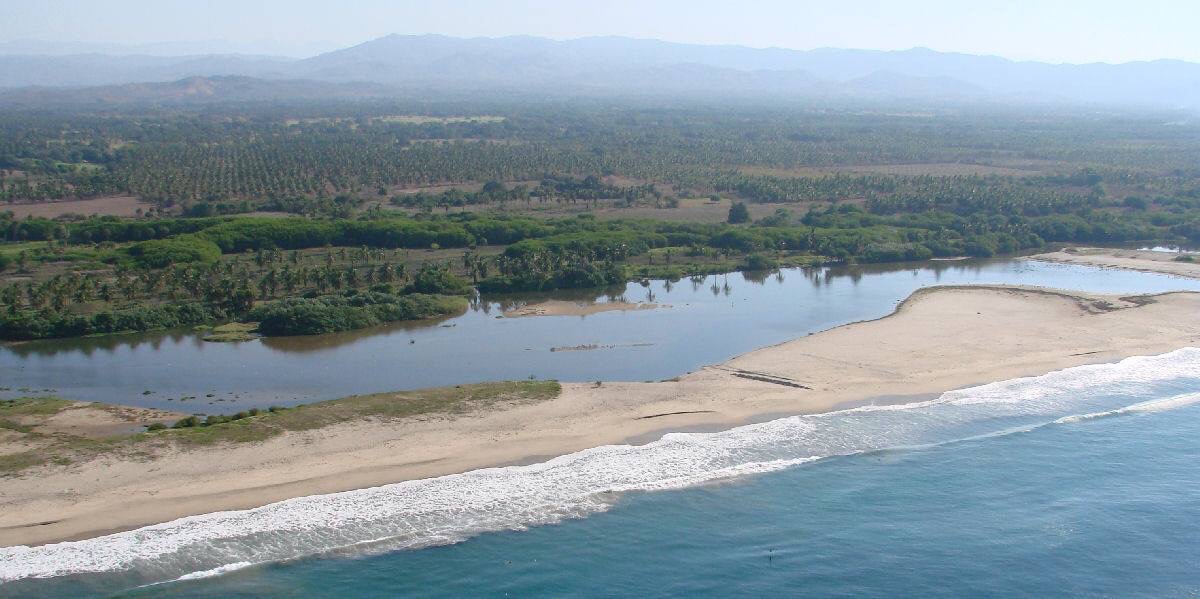 Foto av Playa Minizo med turkosa vatten yta