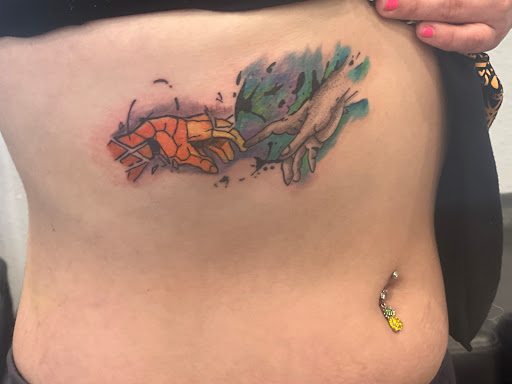 Explore tramp stamp lower back tattoo cover up ideas, creative tattoo ideas in Port Aransas, available at Island Ink studio