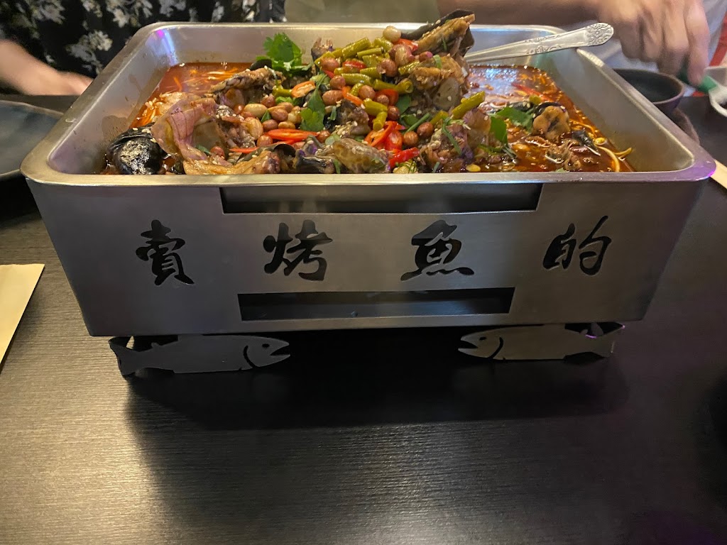 賣烤魚的。 的照片
