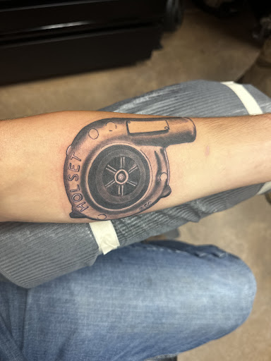 Explore bass fish tattoo ideas, creative tattoo ideas in Camden, available at The Golden Goose Tattoo Studio