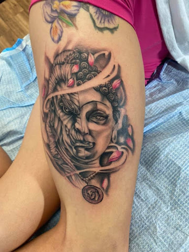 Explore lower back tattoo ideas for men, creative tattoo ideas in Bethlehem, available at Studio 33 Piercings by Angi