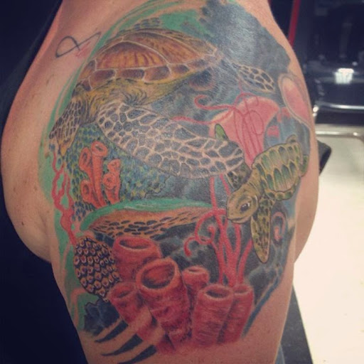 Explore tattoo ideas for a submissive, creative tattoo ideas in Redford, available at Empire Tattoo Studio