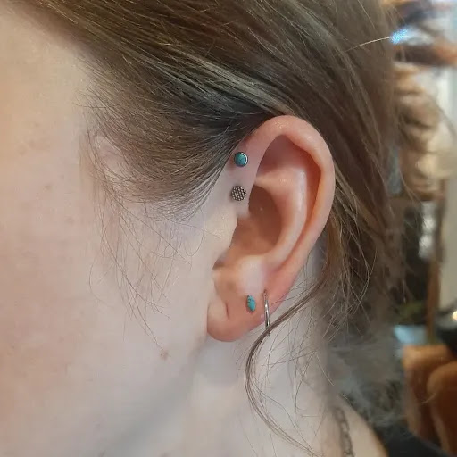 Find in between breast tattoo ideas for your next unique tattoo in Pittsburgh at Pittsburgh Body Piercing