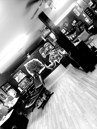 Tattoo Shop «West Coast Tattoos», reviews and photos, 719 E Tennessee St, Florence, AL 35630, USA