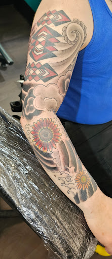 Explore hustle tattoo ideas, creative tattoo ideas in Saint Louis, available at Enigma Tattoos & Body Piercings