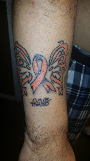 Explore joker hand tattoo ideas, creative tattoo ideas in Lockport, available at Archer Ink Tattoo