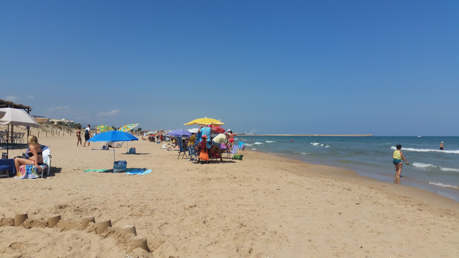 Fotografija Daimus plaža z svetel pesek površino