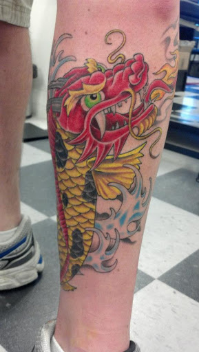 Explore back shoulder tattoo ideas for men, creative tattoo ideas in Pelham, available at Tattoo Fever