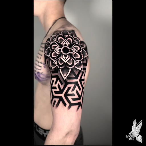 Explore geometric sleeve tattoo ideas, creative tattoo ideas in Fayetteville, available at Sacred Raven Tattoo Shop