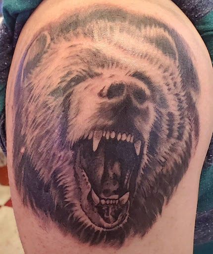 Explore barbed wire tattoo cover up ideas, creative tattoo ideas in Mchenry, available at Lunchbox Tattoo and Body Piercing