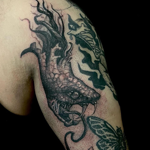 Explore hand small tattoo ideas, creative tattoo ideas in Savannah, available at Tramp Art Studios