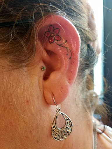 Explore mens back tattoos ideas, creative tattoo ideas in Redding, available at The Salty Sloth Tattoo