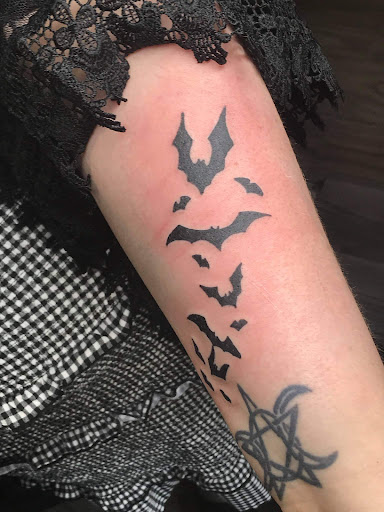 Explore tattoo ideas for back of the neck, creative tattoo ideas in Longmont, available at Sharkys Paradise