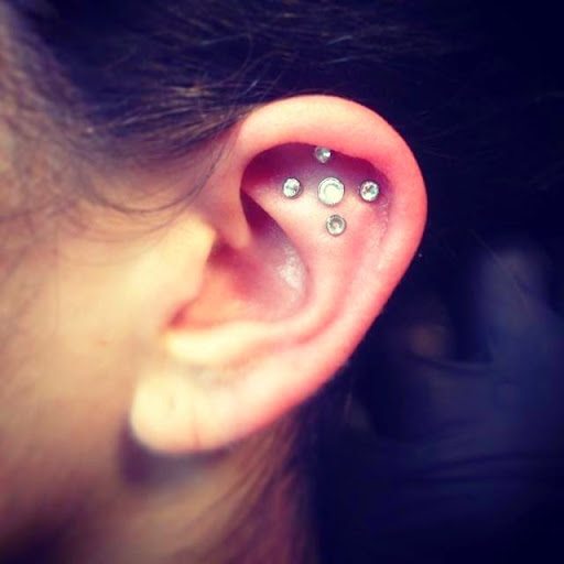 Explore small ear tattoo ideas, creative tattoo ideas in Bellevue, available at Skin and Soul Tattoo & Piercing