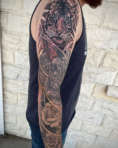 Explore spine tattoo ideas for men, creative tattoo ideas in Lakeview, available at Backwoods Tattoo Studio