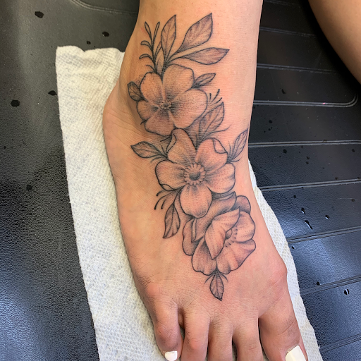 Explore flower garden tattoo ideas, creative tattoo ideas in Sanford, available at Luv Ink