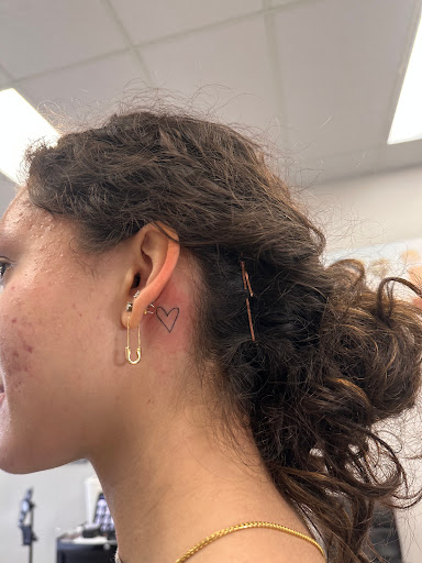 Explore black hole tattoo ideas, creative tattoo ideas in Winter Park, available at Fine Ink Studios Tattoos