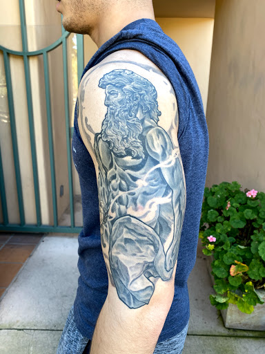 Explore snake sleeve tattoo ideas, creative tattoo ideas in Monterey, available at Wholehearted Tattoo