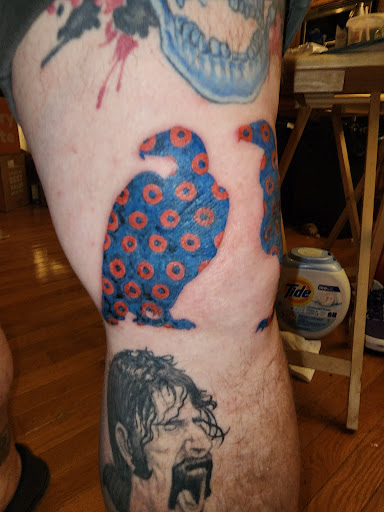 Explore cover up lower back tattoo ideas, creative tattoo ideas in Wayne, available at Shotsies Tattoo