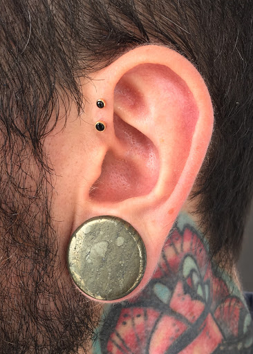 Explore gnome tattoo ideas, creative tattoo ideas in New Orleans, available at Purity Body Arts