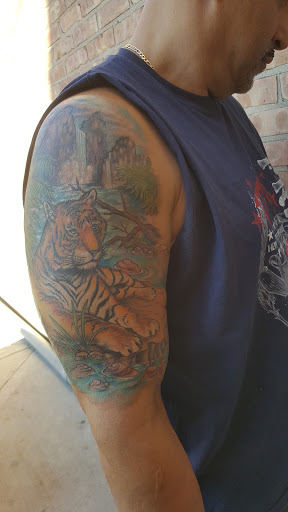 Explore guitar tattoo ideas, creative tattoo ideas in Chicago, available at Chi Town Tattoo & Body Piercing