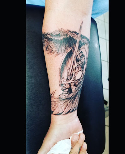 Explore trinidad tattoo ideas, creative tattoo ideas in Abington, available at Tattoo Galaxy (Abington) Piercing and Custom Tattoos