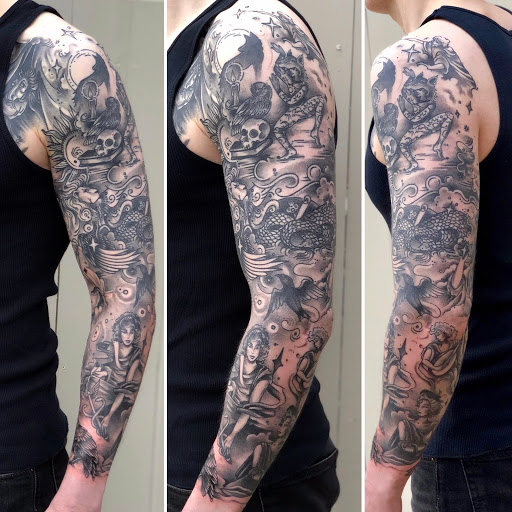 Explore cat and dog tattoo ideas, creative tattoo ideas in Bowling Green, available at BroadWing Tattoo and Body Piercing