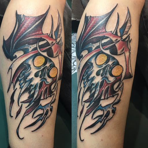 Find cardinal tattoo ideas for ladies for your next unique tattoo in Milford at Golden Hammer Tattoo Studios