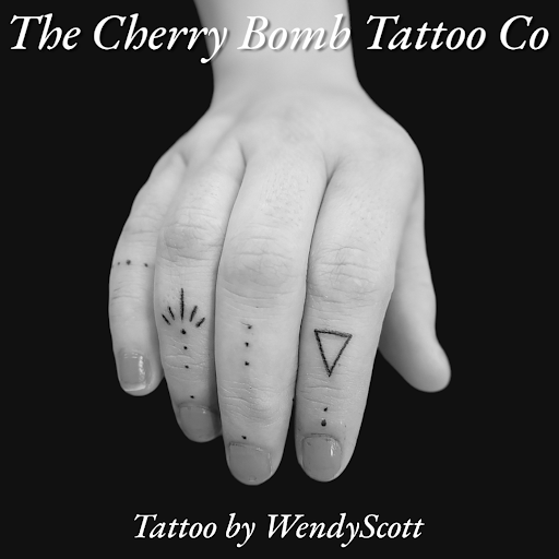 Explore buddha tattoo ideas, creative tattoo ideas in Lees Summit, available at The Cherry Bomb Tattoo Co.