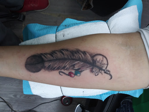 Explore simple spine tattoo ideas, creative tattoo ideas in Denton, available at Lizards Ink Tattoo and piercing, Denton, tx