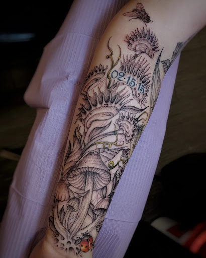 Explore mens rib tattoo ideas, creative tattoo ideas in Palm Harbor, available at Angry Owl Tattoo and Piercing