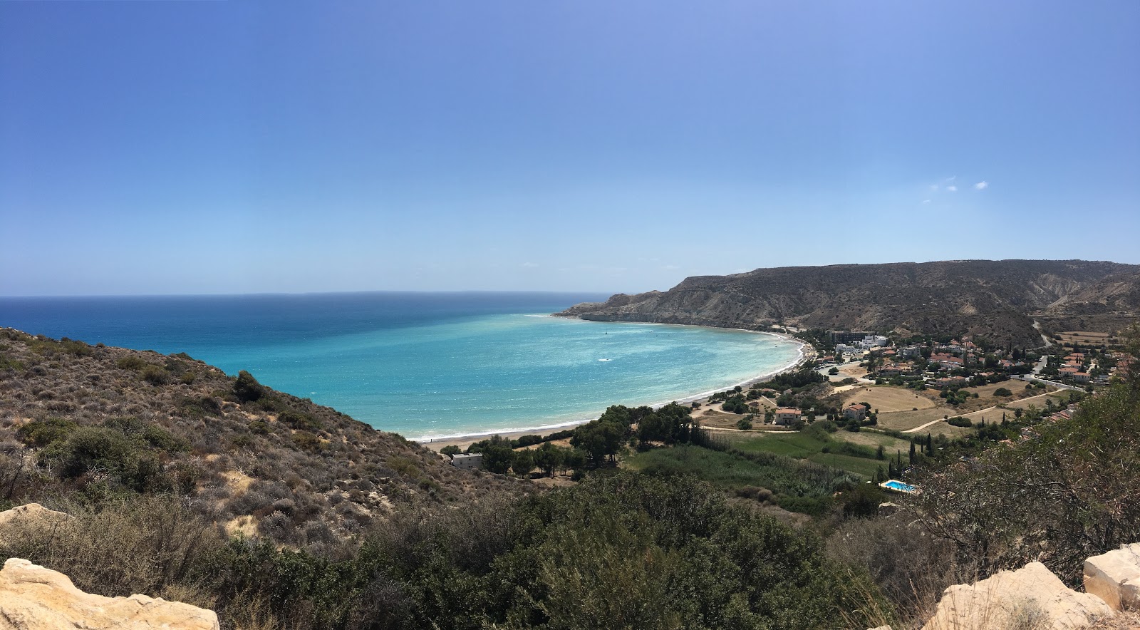 Photo of Pissouri beach with turquoise pure water surface
