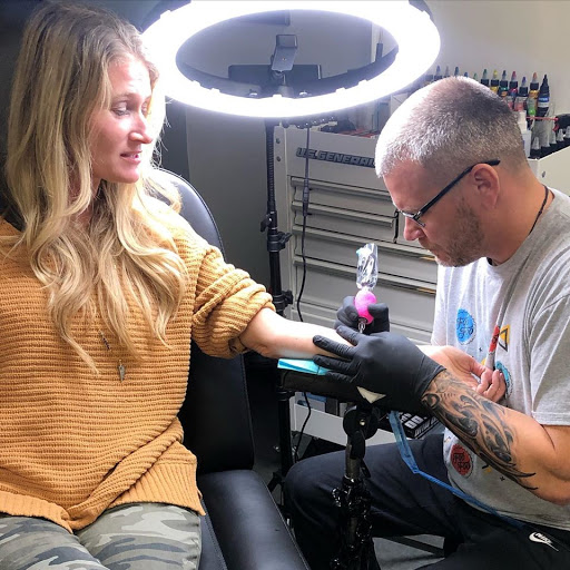 Explore tattoo ideas to cover up a name, creative tattoo ideas in Navarre, available at Eleven 11 Tattoo Studio