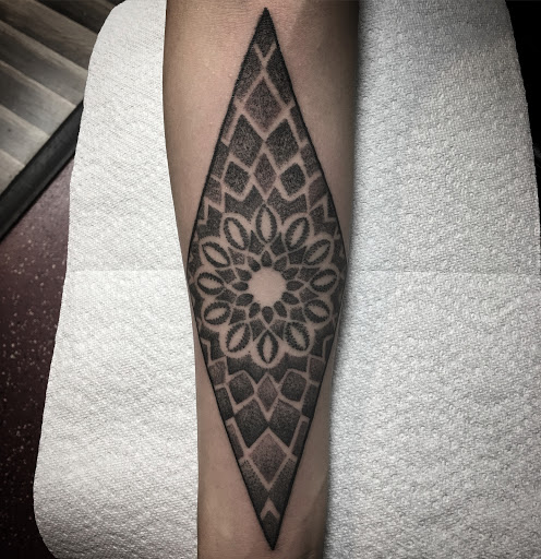 Explore good ideas for a cover up tattoo, creative tattoo ideas in Matthews, available at Divine Arts Tattoo Company