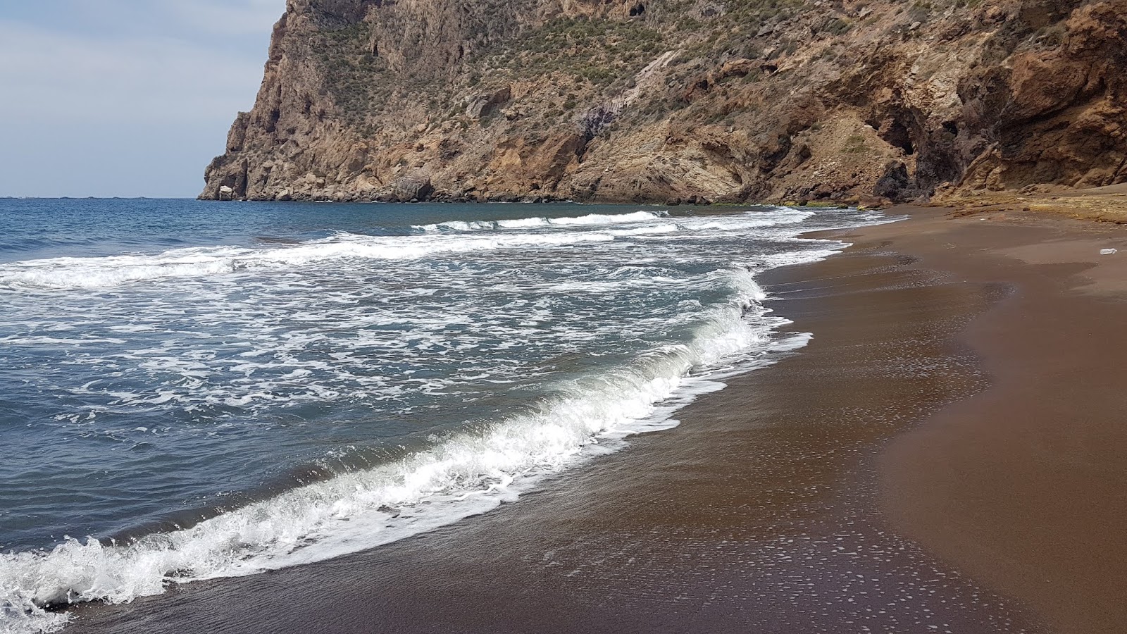 Valokuva Cola del Caballoista. pinnalla sininen vesi:n kanssa