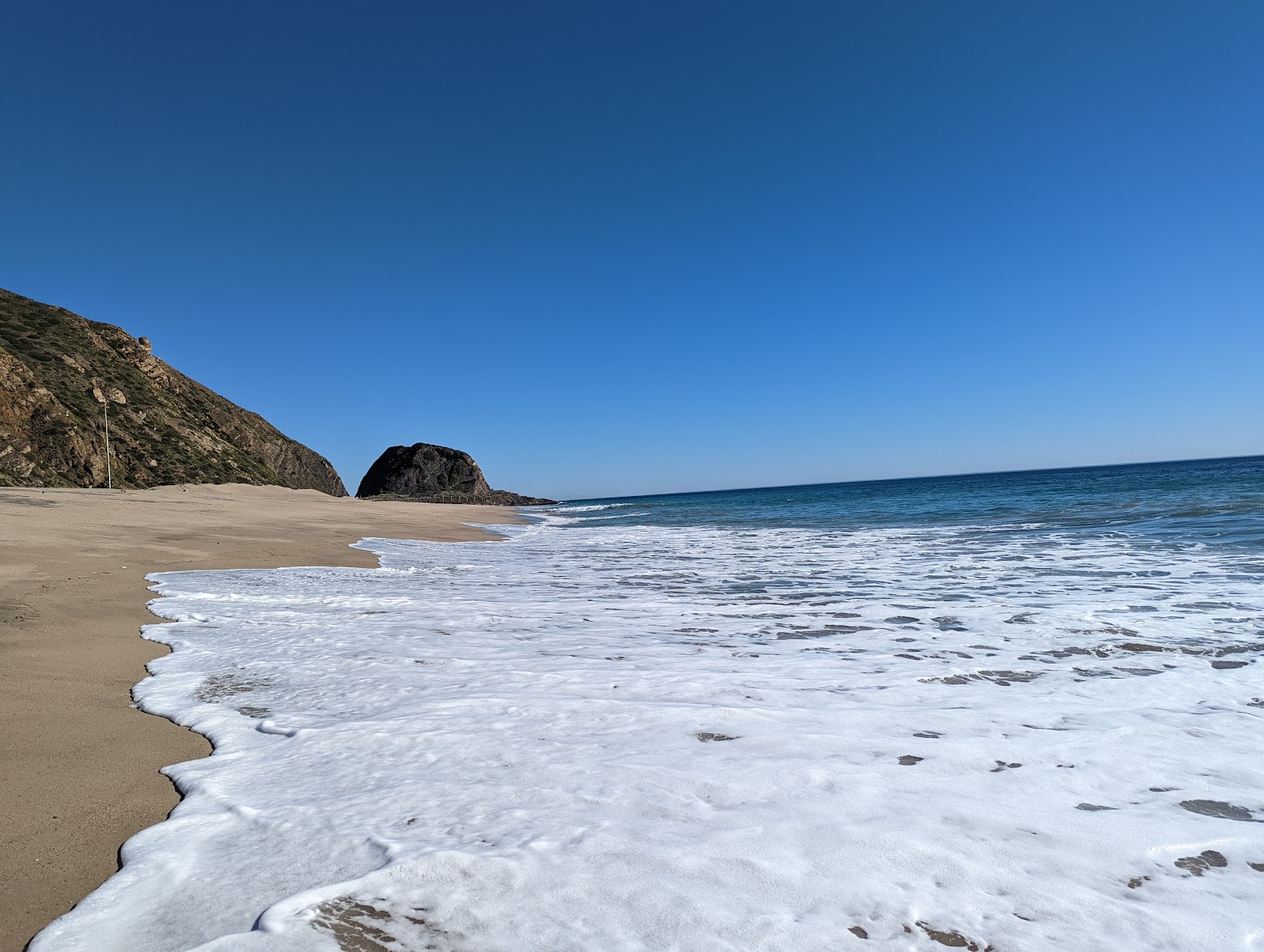 Foto af Mugu beach med høj niveau af renlighed