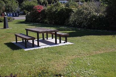 Small park with picnic table, and seating