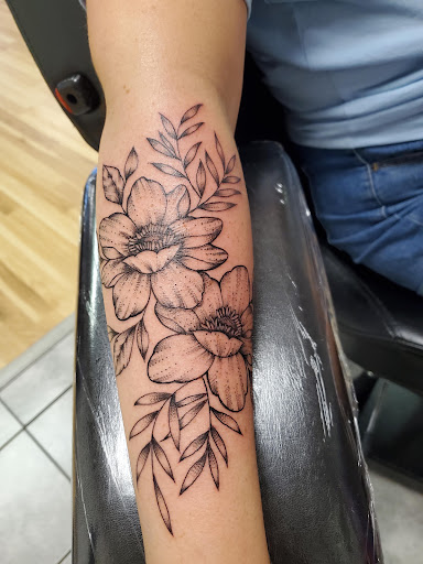 Explore olive branch tattoo ideas, creative tattoo ideas in Ocean Springs, available at Heart & Daggers Tattoo Studio LLC